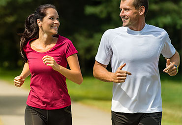Couple enjoying a run after receiving chiropractic care